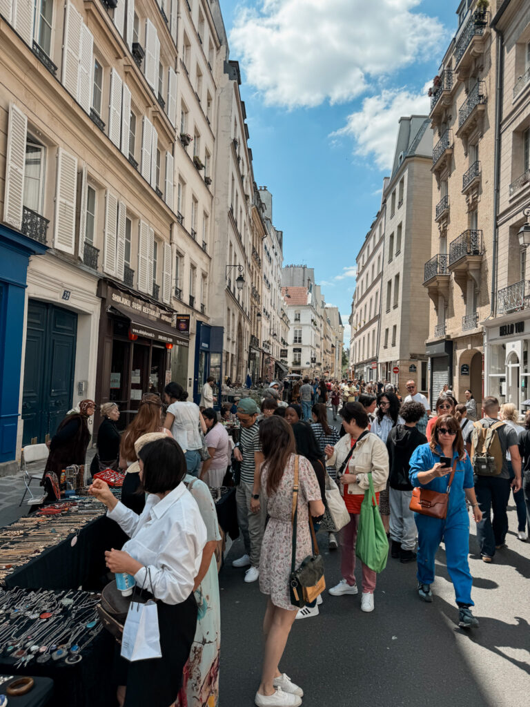 Crowd of people in Paris during the summer months.