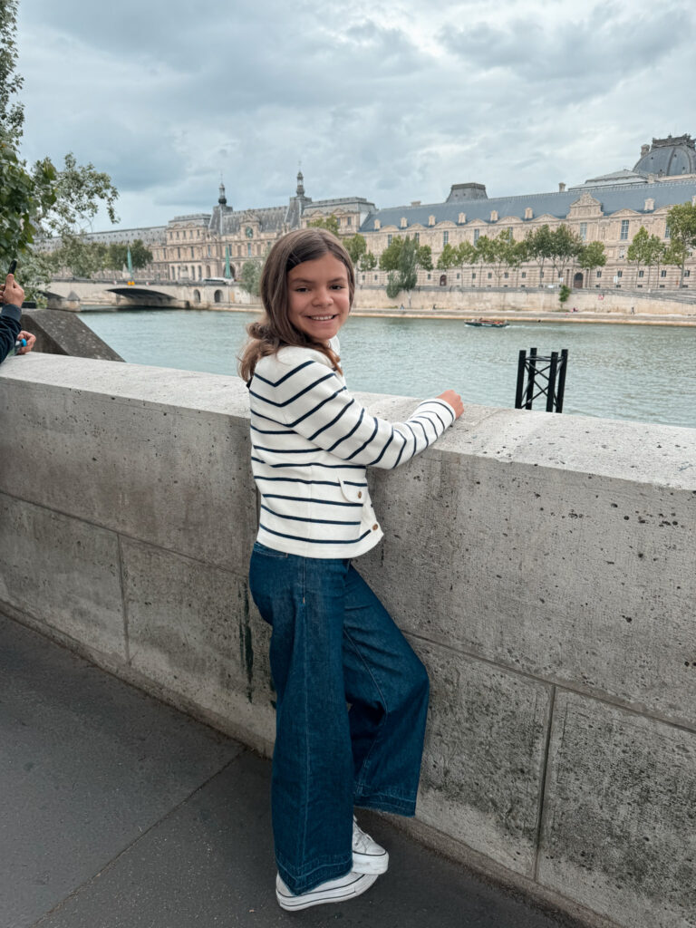 kids stripe sweater and jeans Girl in stripe sweater wearing jeans in Paris.