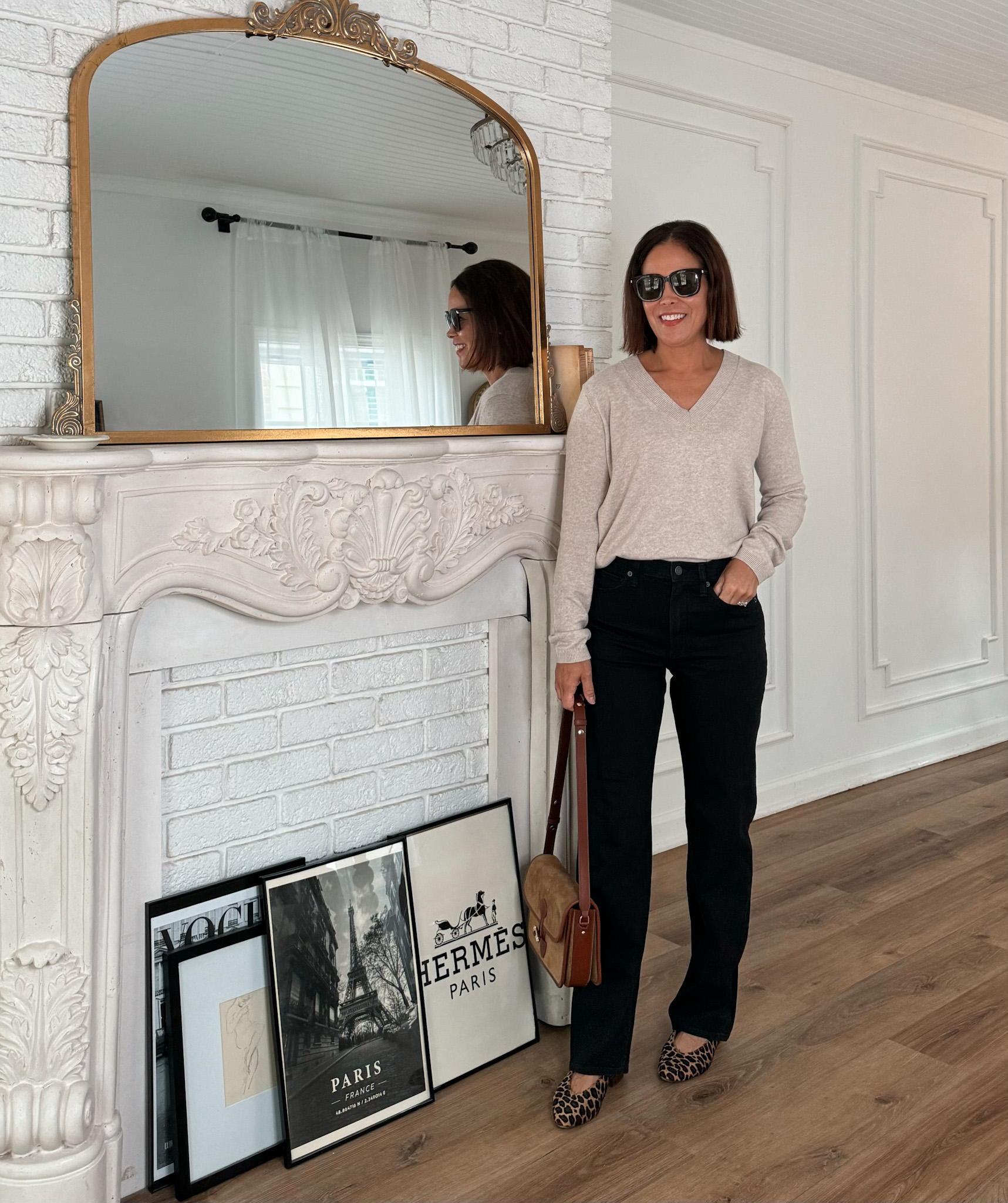 woman wearing black denim and sweater from gap.