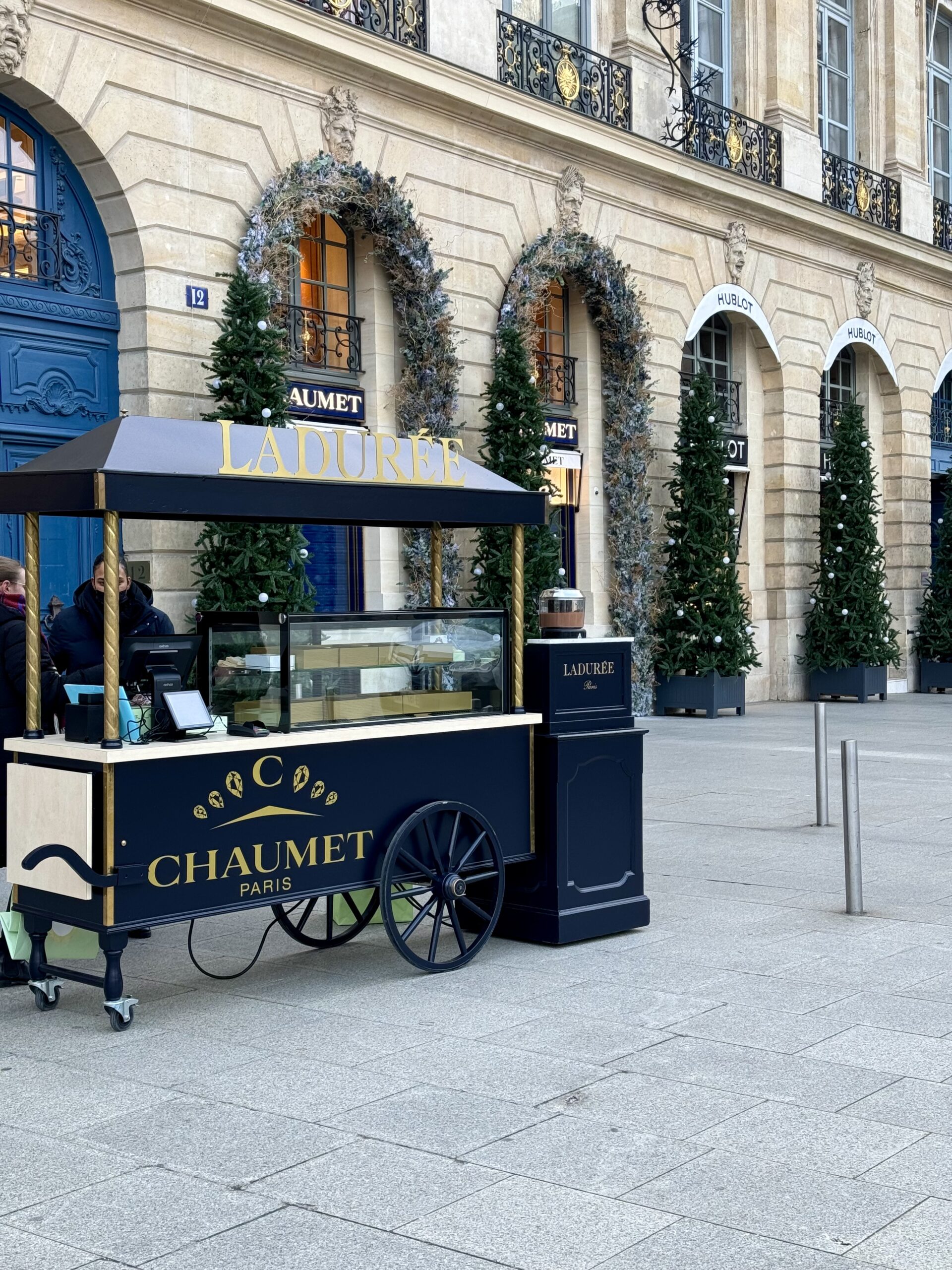 Stand in Paris of woman outside during christmas.