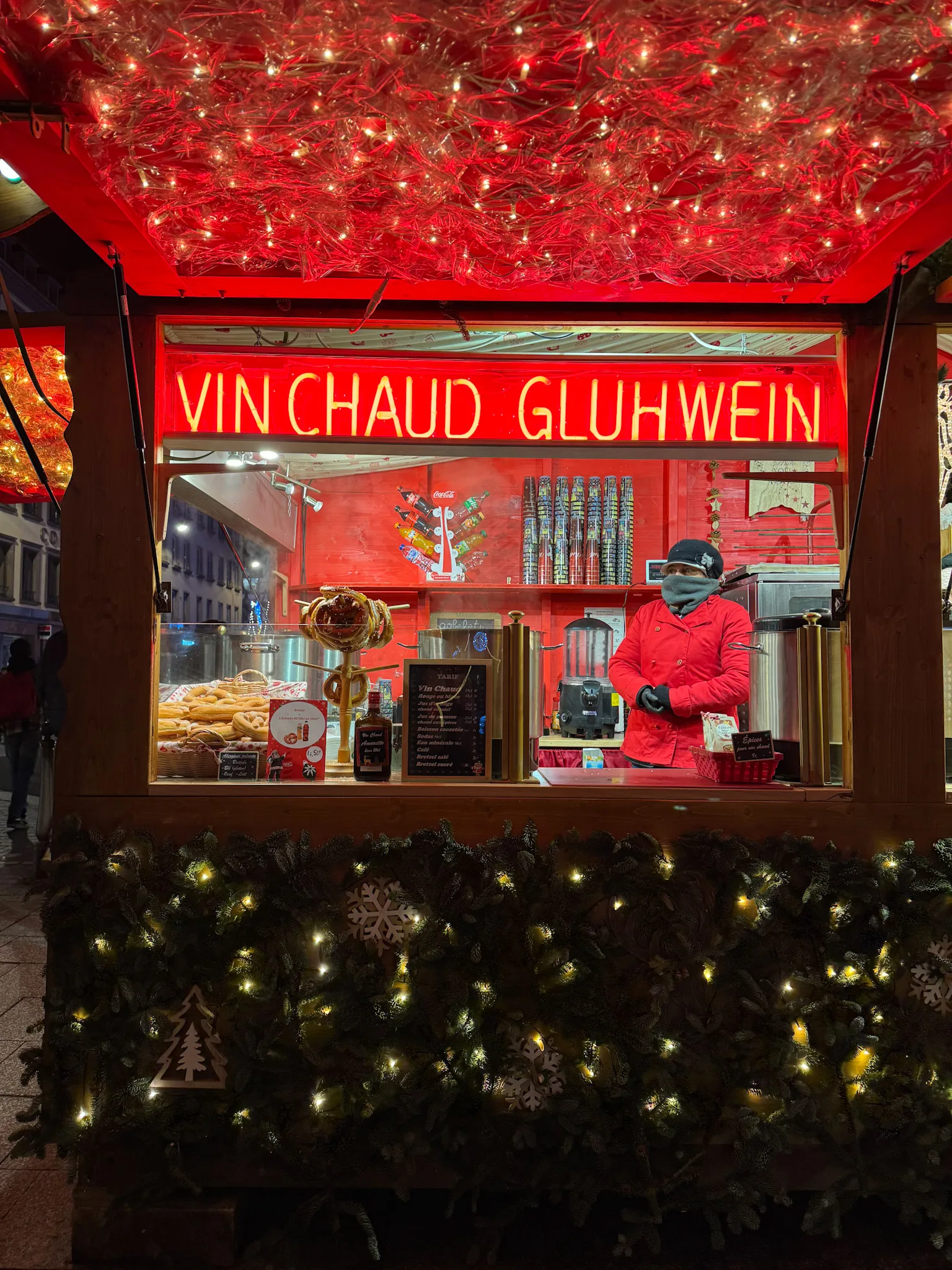 Sign of Vinchaud in red at night.
