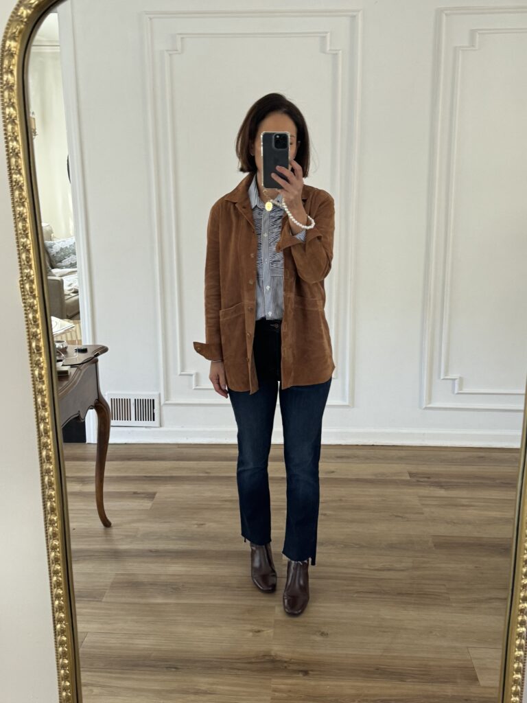 Sézane gift jacket Woman in suede jacket with blue and white button down | Sézane Gift Ideas