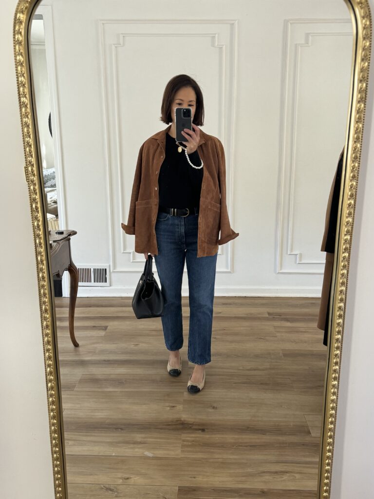 suede jacket Woman wearing suede jacket with denim and ballet flats.