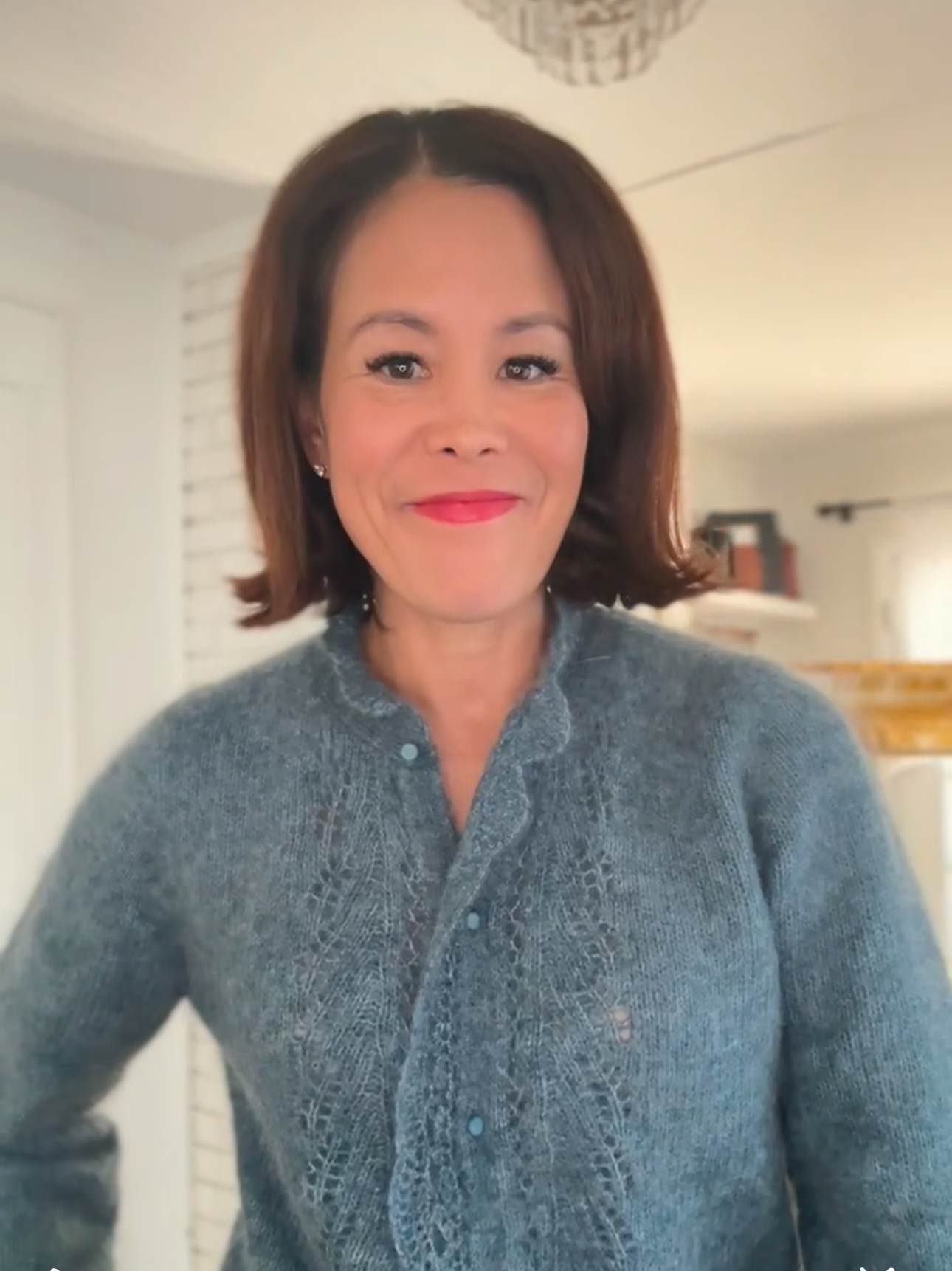 blue sezane cardigan Woman wearing blue sezane cardigan.