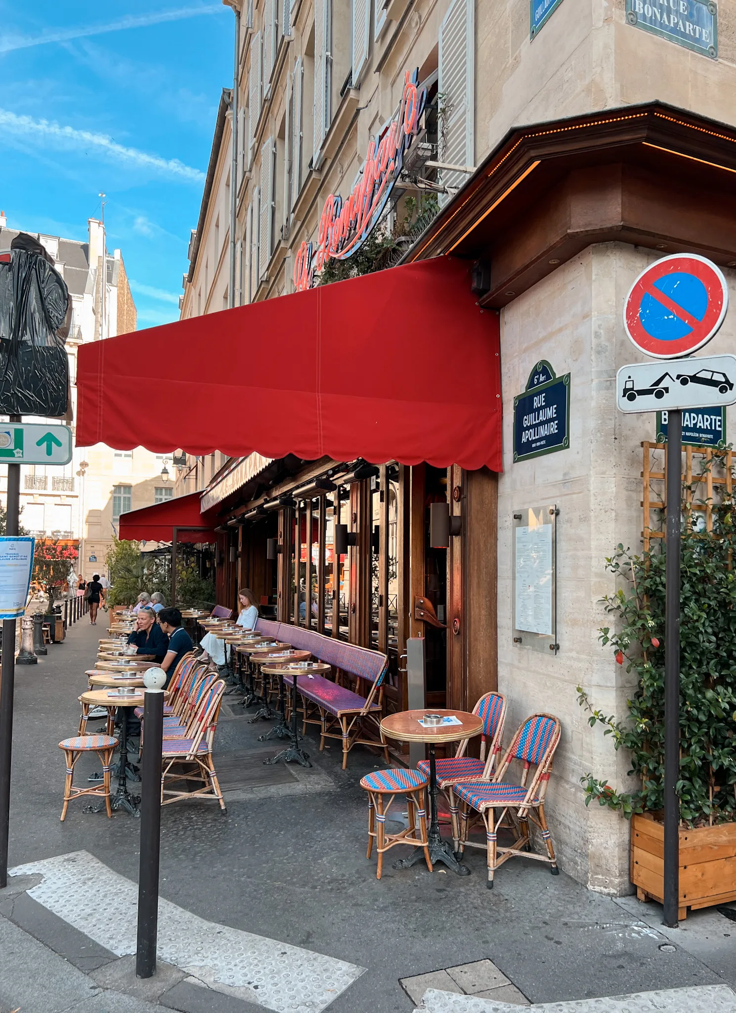 Woman in luxembourg gardens Exterior shot of Cafe Bonaparte in Paris.
