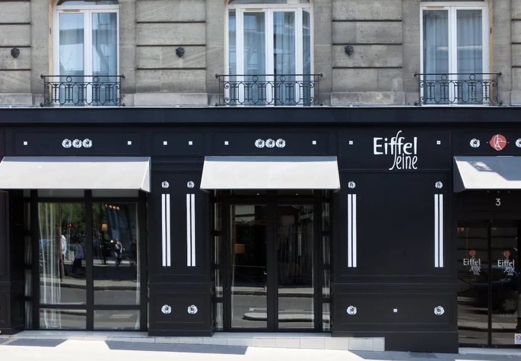 Exterior shot of hotel in paris with eiffel tower views.