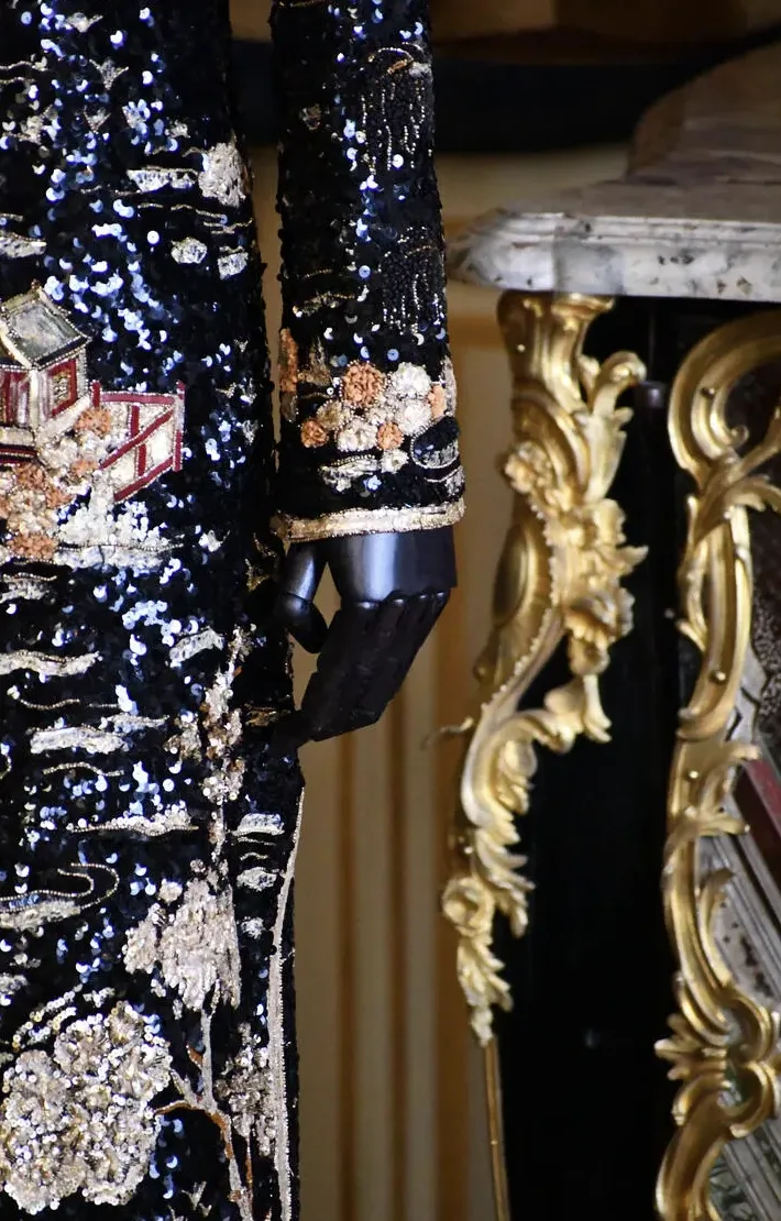 Interior of Grand Palais Chanel sequin dress at the Louvre.