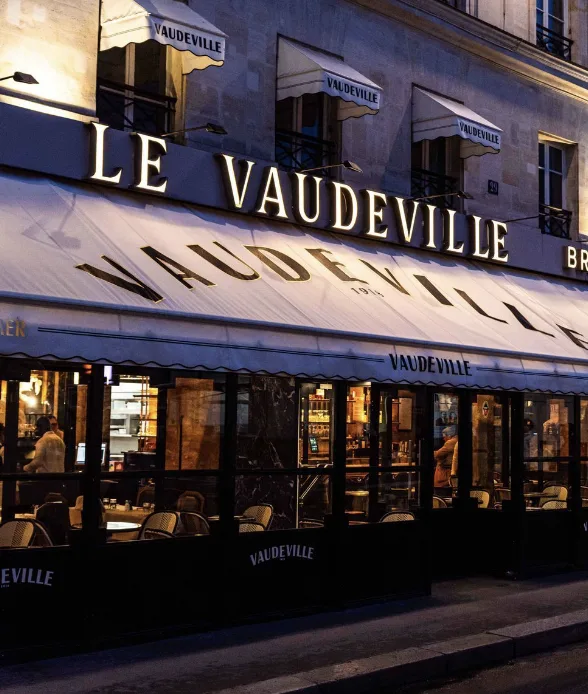 Exterior shot of Le Vaudeville in Paris.