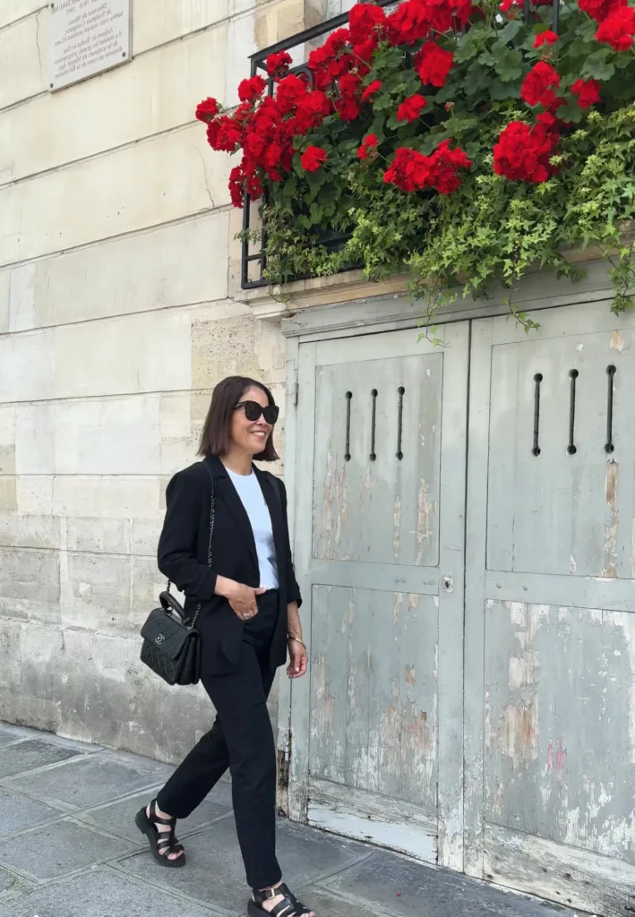 Woman wearing Allie Sandals from Sezane.