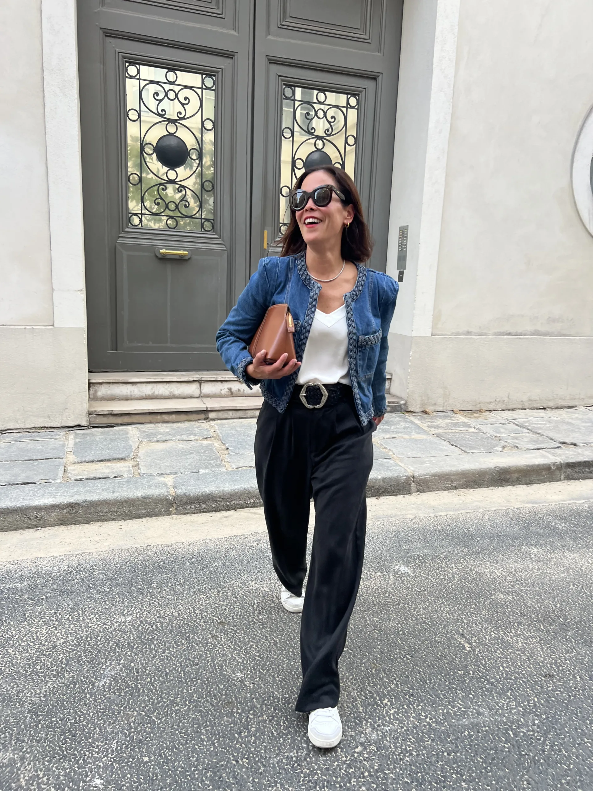 Woman wearing denim jacket and trousers