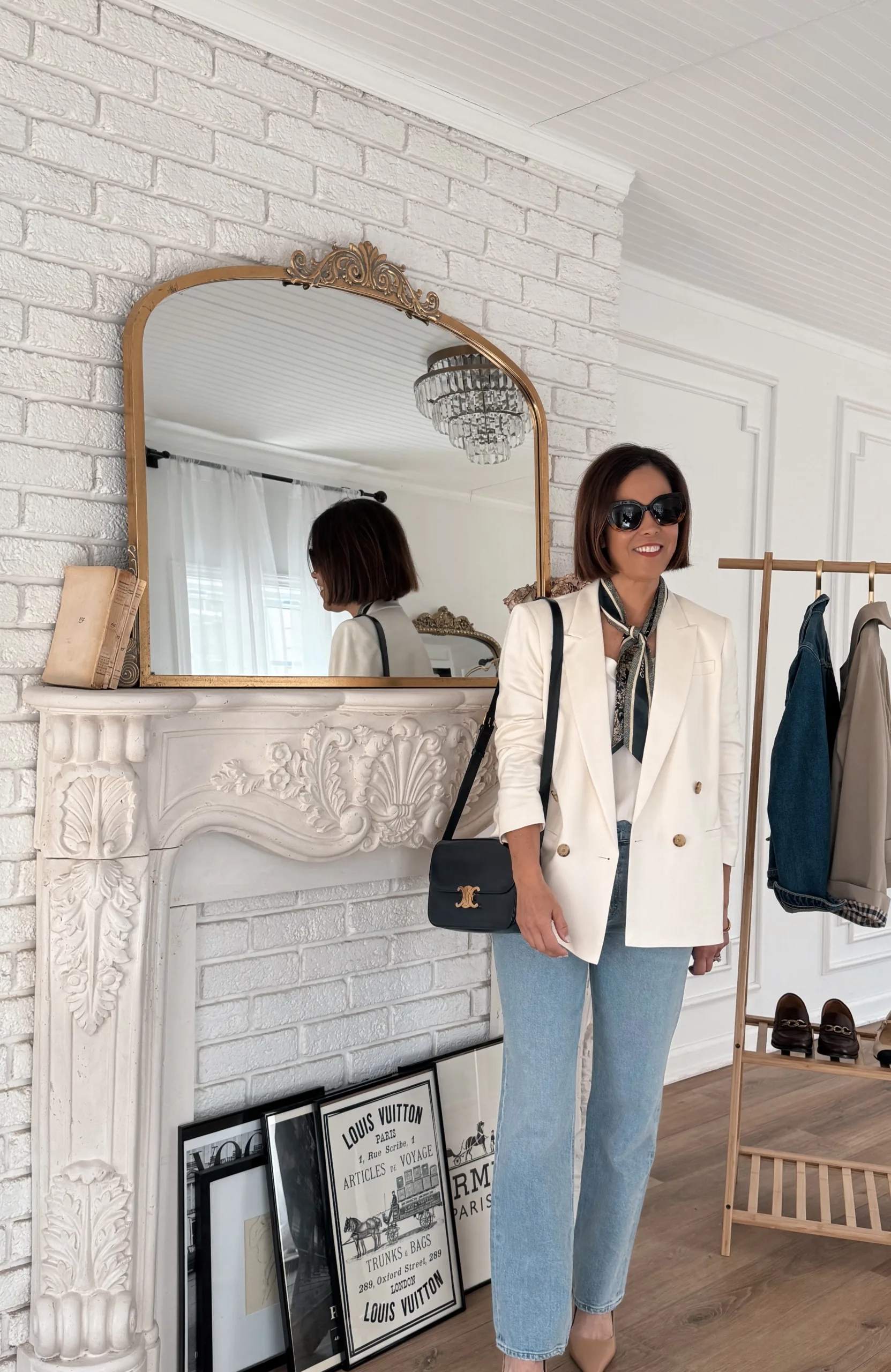 Woman wearing cream blazer with light colored denim.