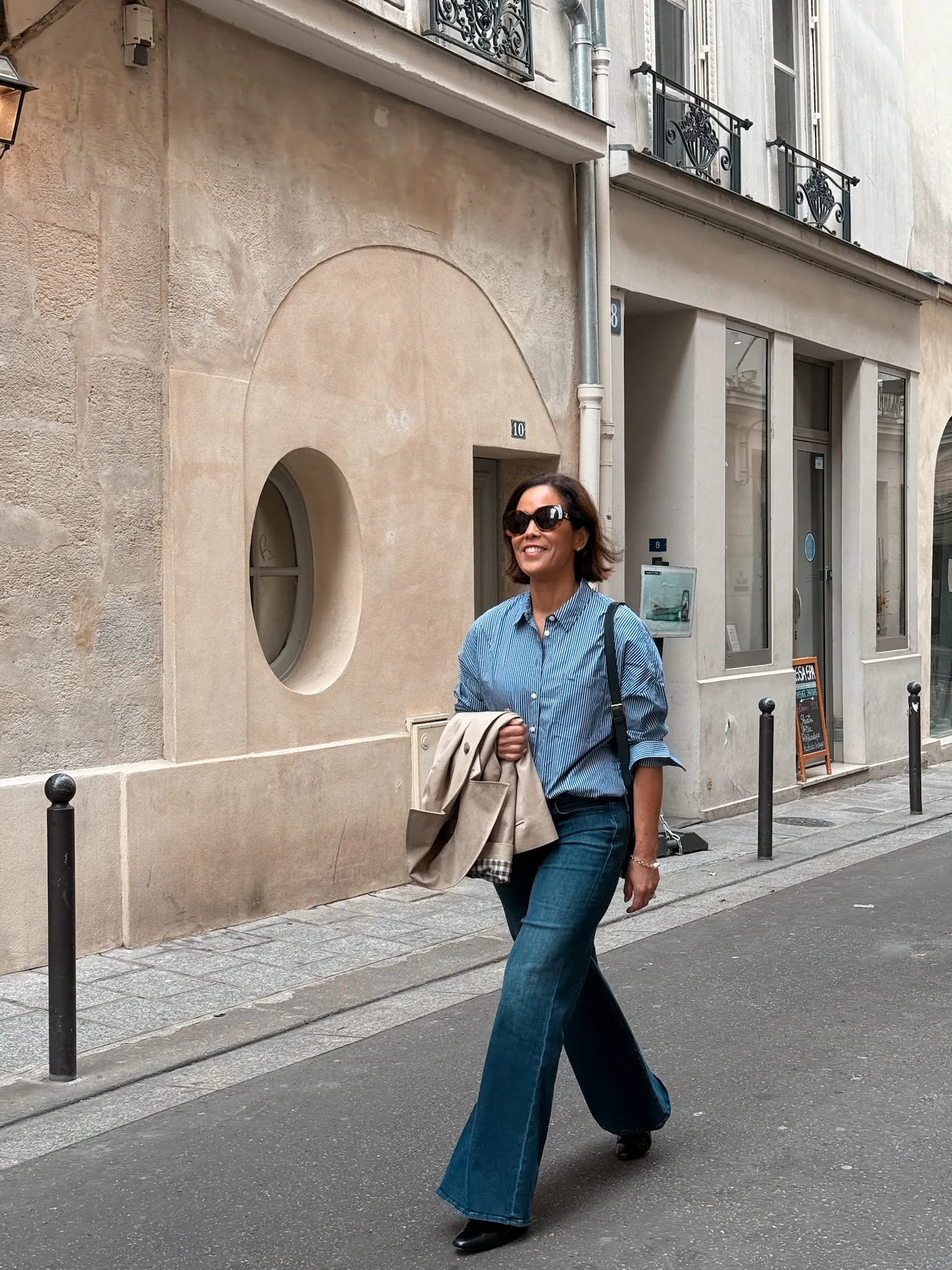 Woman in stripe shirt with denim.