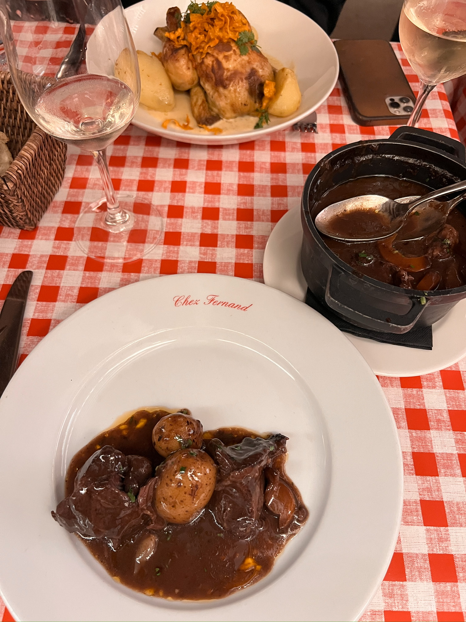 Classic french dishes sitting on a table for what to do in Paris in the fall and autumn.