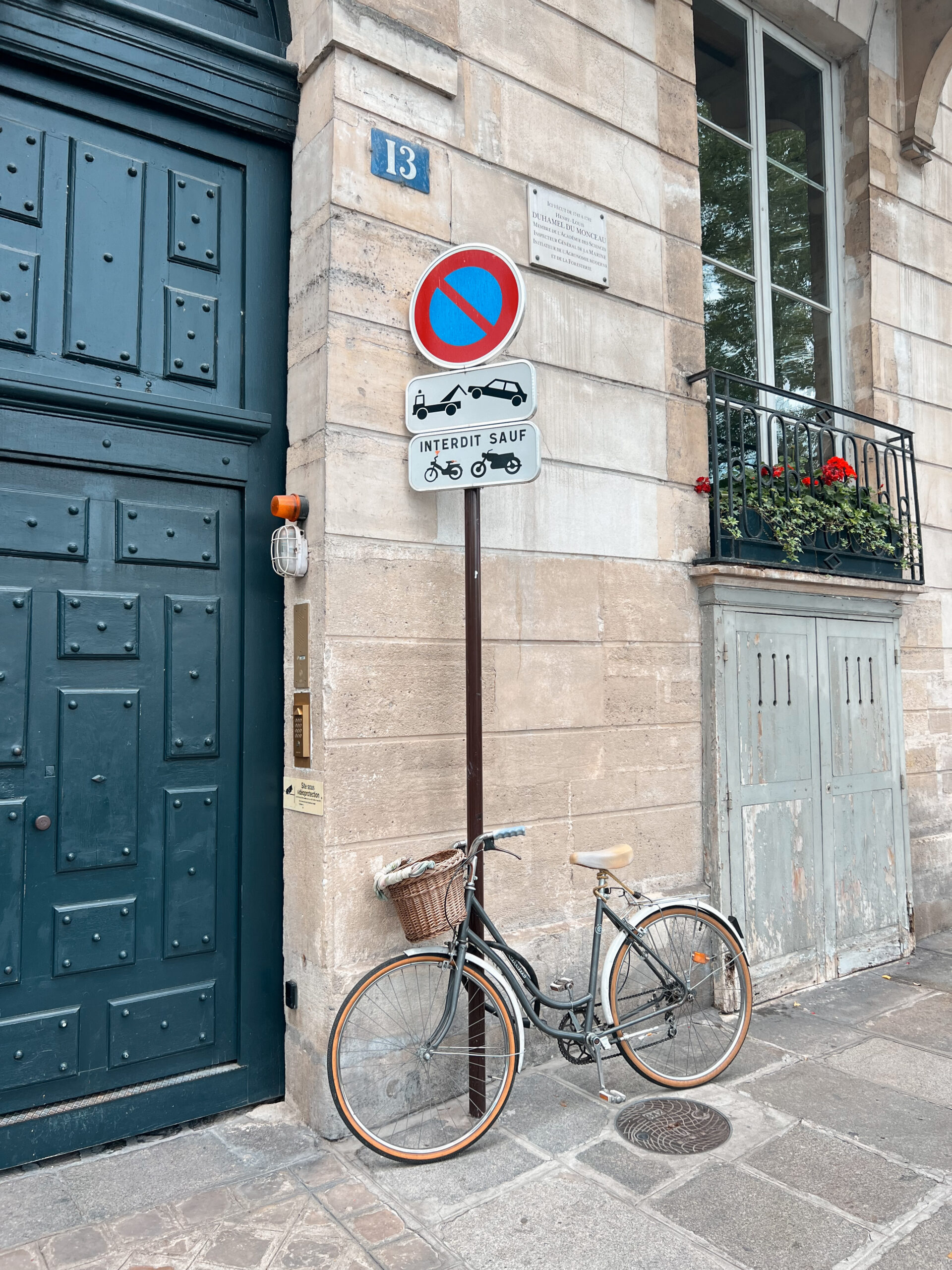 Bike leaning against a pole on Île Saint Louis in Paris.