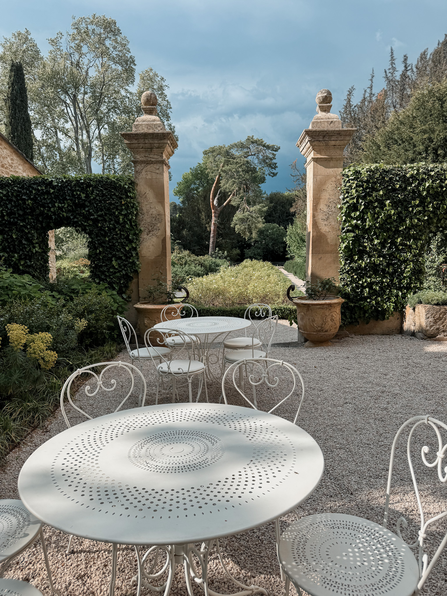 Garden terrace at Le Galinier Lourmarin boutique hotel with outdoor seating in Provence